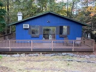 9 Cardiff, Rock Hill, NY 12775 - view of front of house with a chimney and a deck