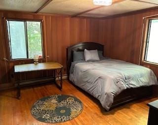 9 Cardiff, Rock Hill, NY 12775 - bedroom featuring wood finished floors and wooden walls