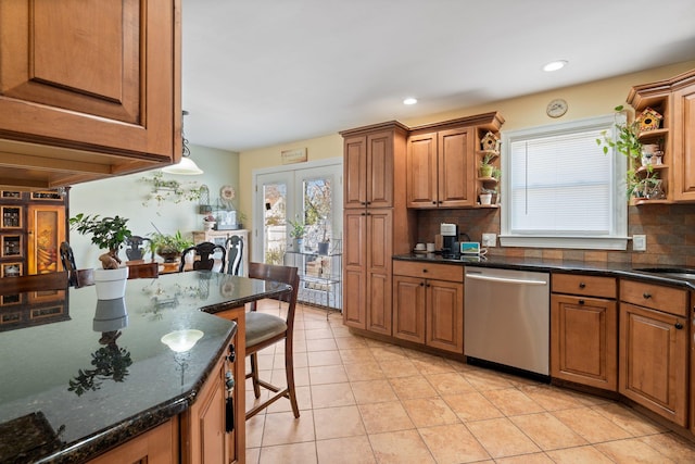 kitchen featuring light tile patterned flooring, backsplash, brown cabinets, open shelves, and dishwasher