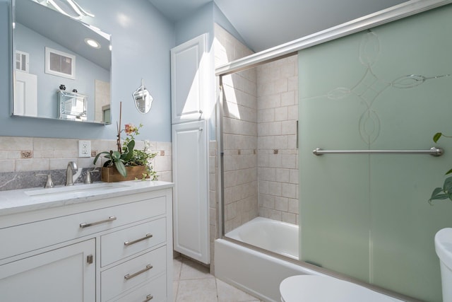 bathroom featuring shower / bath combination with glass door, tile patterned floors, visible vents, toilet, and vanity