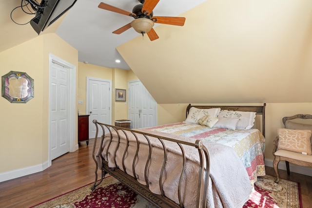 bedroom featuring recessed lighting, lofted ceiling, baseboards, and wood finished floors