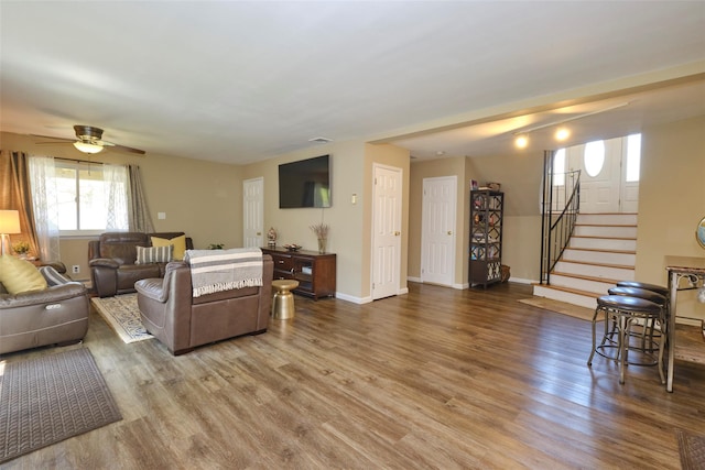 1 Neubrech Ct, Jericho, NY 11753 - living room featuring a ceiling fan, stairs, wood finished floors, and a wealth of natural light