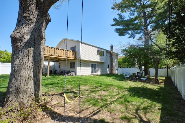 1 Neubrech Ct, Jericho, NY 11753 - back of house with a fenced backyard, a wooden deck, a yard, and a chimney