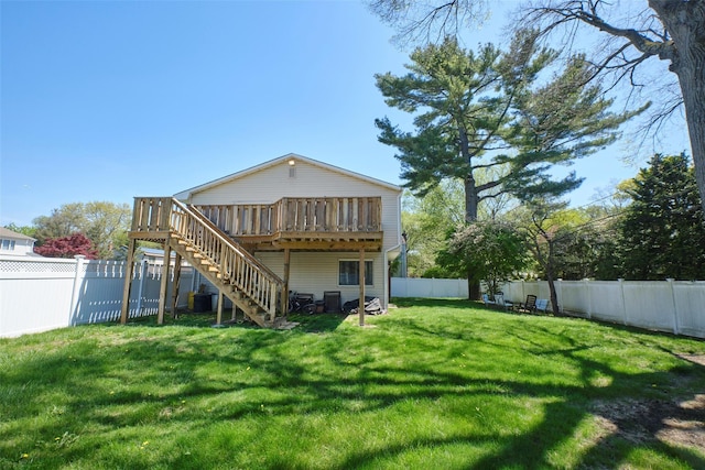 1 Neubrech Ct, Jericho, NY 11753 - rear view of house with a lawn, a fenced backyard, a wooden deck, and stairway