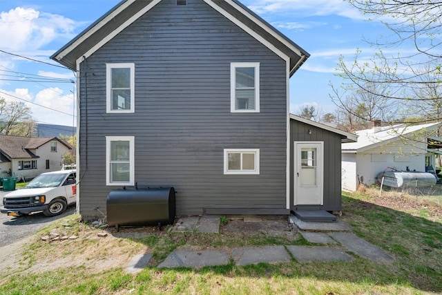rear view of house featuring heating fuel