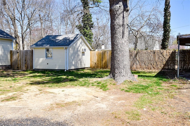 129 Locust Dr, Mastic Beach, NY 11951 - fenced backyard featuring an outbuilding and a storage unit