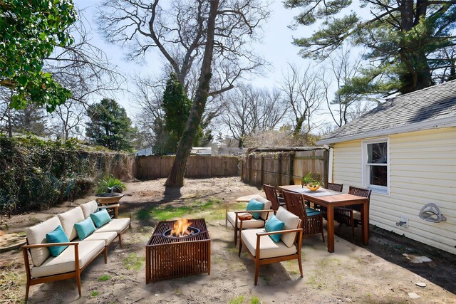 129 Locust Dr, Mastic Beach, NY 11951 - view of patio with an outdoor living space with a fire pit, a fenced backyard, and outdoor dining space
