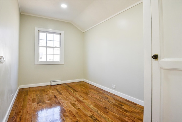 129 Locust Dr, Mastic Beach, NY 11951 - bonus room with lofted ceiling, wood finished floors, baseboards, and recessed lighting