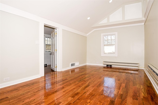 129 Locust Dr, Mastic Beach, NY 11951 - spare room featuring a baseboard radiator, wood finished floors, recessed lighting, vaulted ceiling, and baseboard heating
