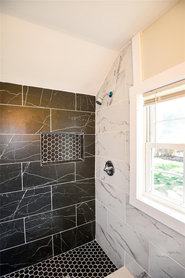 129 Locust Dr, Mastic Beach, NY 11951 - bathroom featuring tiled shower and lofted ceiling