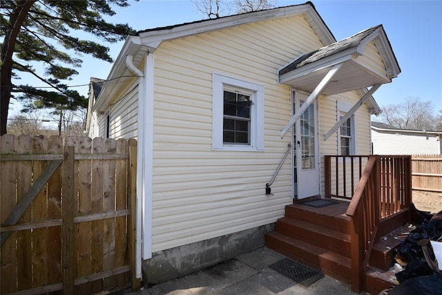 129 Locust Dr, Mastic Beach, NY 11951 - view of side of home with fence