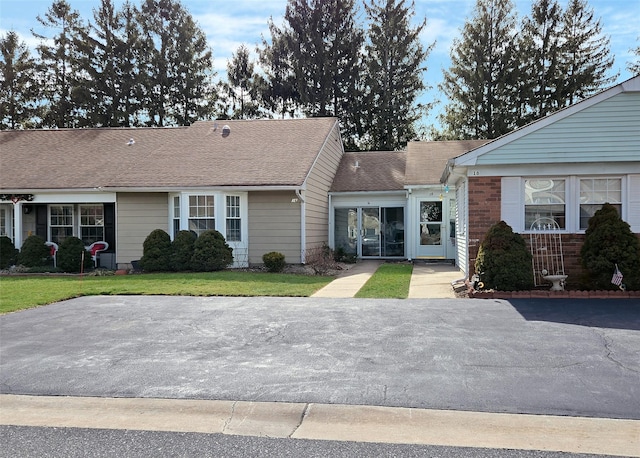 16 Hearthside Dr, Mount Sinai, NY 11766 - view of front facade with a front lawn and a shingled roof