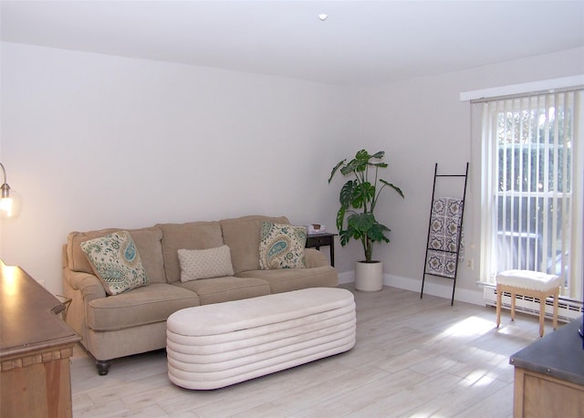 16 Hearthside Dr, Mount Sinai, NY 11766 - living area with a baseboard radiator, baseboards, and light wood finished floors