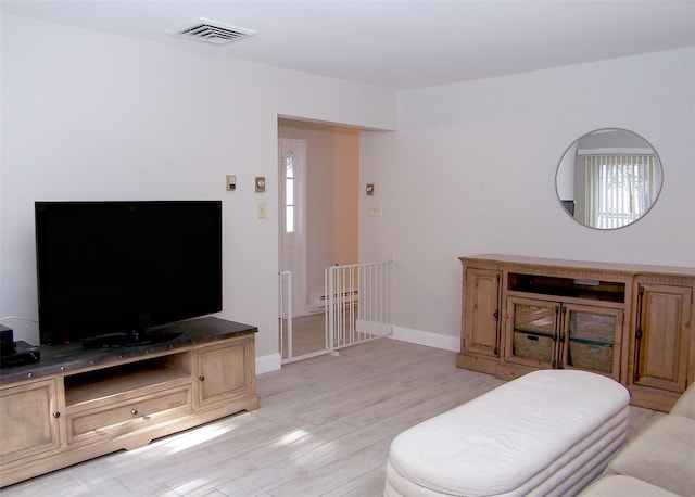 16 Hearthside Dr, Mount Sinai, NY 11766 - living area with light wood-style floors, visible vents, and baseboards