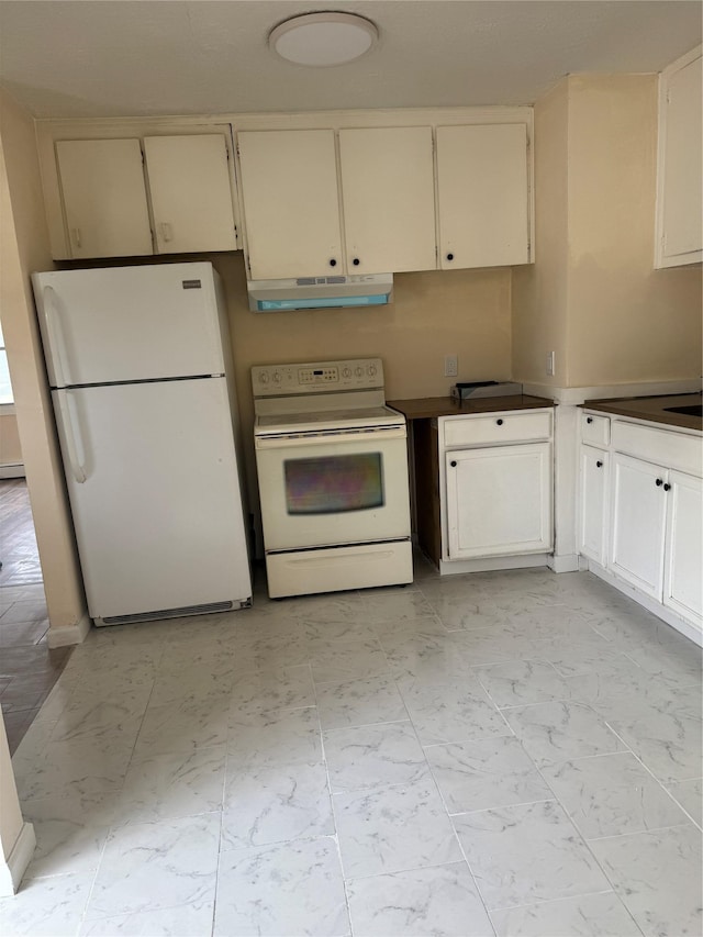 kitchen featuring a baseboard radiator, marble finish floor, under cabinet range hood, white appliances, and cream cabinetry
