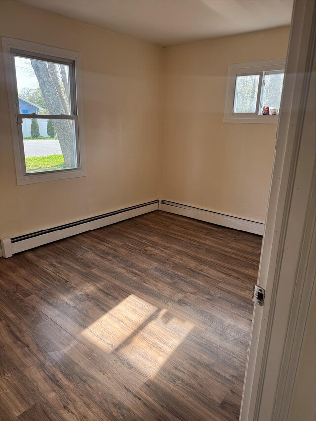 spare room with wood finished floors