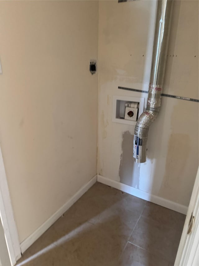 laundry area with laundry area, hookup for a washing machine, and baseboards