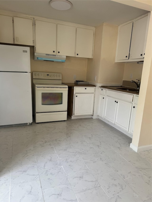 kitchen featuring marble finish floor, dark countertops, white appliances, under cabinet range hood, and a sink