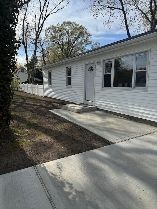 exterior space featuring fence and a patio area