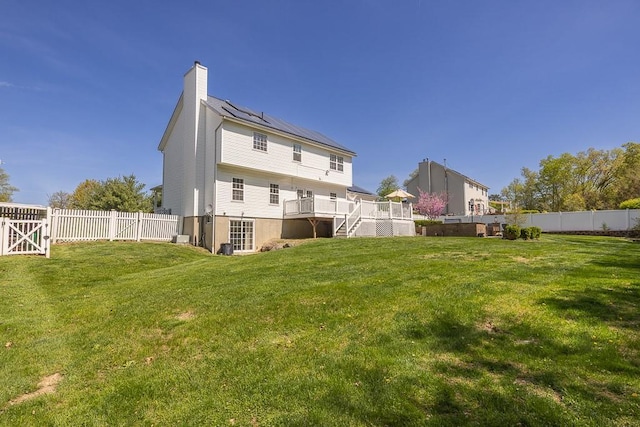 17 Frances Ln, Monroe, NY 10950 - back of house featuring a chimney, a fenced backyard, a wooden deck, and stairway