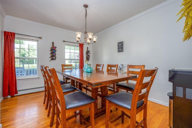 17 Frances Ln, Monroe, NY 10950 - dining space featuring baseboard heating, light wood-type flooring, baseboards, an inviting chandelier, and ornamental molding