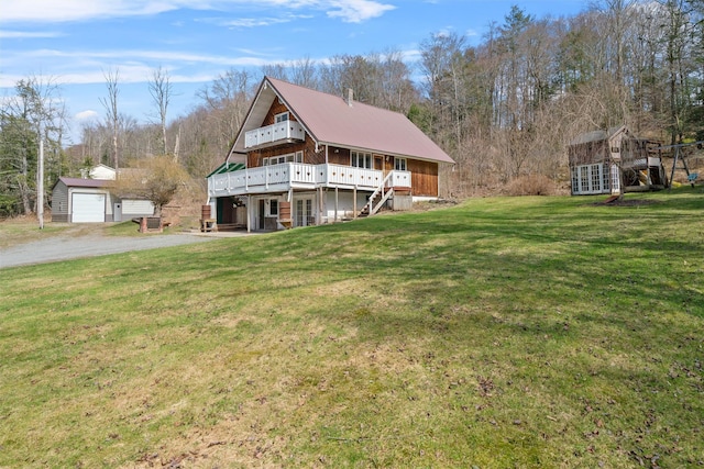 242 Callicoon Center Rd, Jeffersonville, NY 12748 - back of property featuring stairway, an outbuilding, a yard, driveway, and a deck