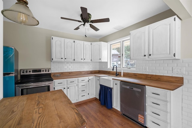 242 Callicoon Center Rd, Jeffersonville, NY 12748 - kitchen with white cabinetry, tasteful backsplash, appliances with stainless steel finishes, wooden counters, and a ceiling fan