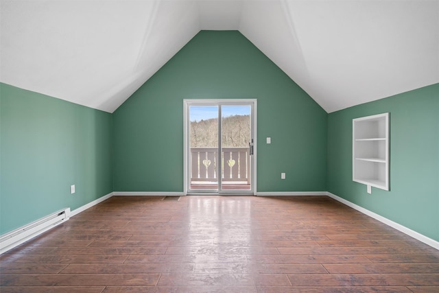 242 Callicoon Center Rd, Jeffersonville, NY 12748 - bonus room with lofted ceiling, built in shelves, baseboard heating, and dark wood finished floors