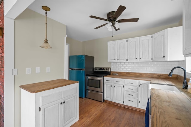 242 Callicoon Center Rd, Jeffersonville, NY 12748 - kitchen featuring white cabinets, ceiling fan, stainless steel range with electric stovetop, freestanding refrigerator, and butcher block countertops