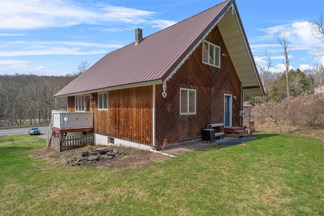 242 Callicoon Center Rd, Jeffersonville, NY 12748 - view of home's exterior with metal roof, cooling unit, a yard, and entry steps