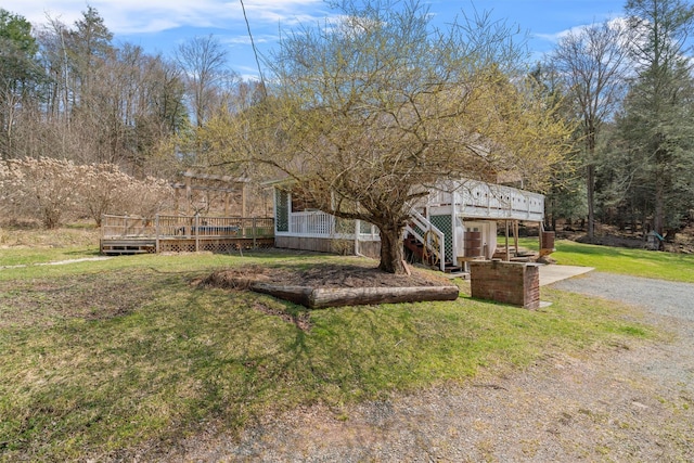 242 Callicoon Center Rd, Jeffersonville, NY 12748 - view of front of property with a front lawn, a wooden deck, stairway, and driveway