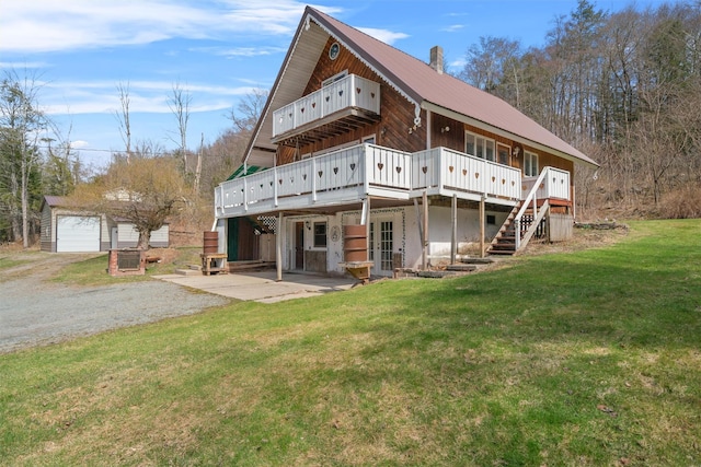 242 Callicoon Center Rd, Jeffersonville, NY 12748 - rear view of house with an outdoor structure, a yard, a wooden deck, and metal roof