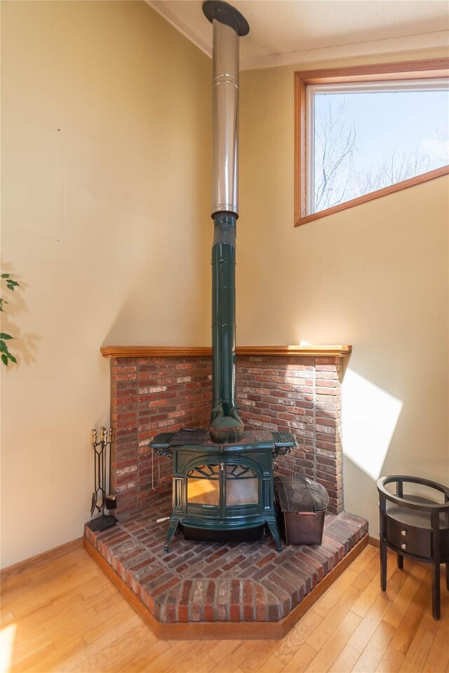 295 Overhill Rd, Stormville, NY 12582 - room details with baseboards, wood finished floors, and a wood stove