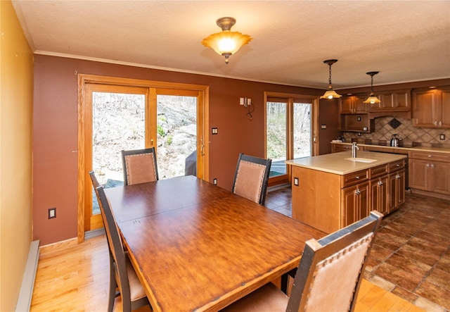 295 Overhill Rd, Stormville, NY 12582 - dining space featuring baseboard heating, baseboards, and ornamental molding