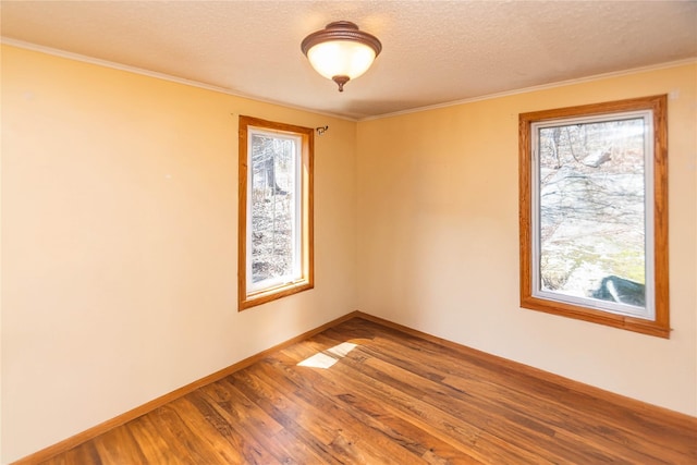 295 Overhill Rd, Stormville, NY 12582 - unfurnished room with wood finished floors, a textured ceiling, crown molding, and baseboards