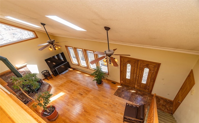 295 Overhill Rd, Stormville, NY 12582 - entryway with vaulted ceiling, a ceiling fan, a textured ceiling, and light wood-type flooring