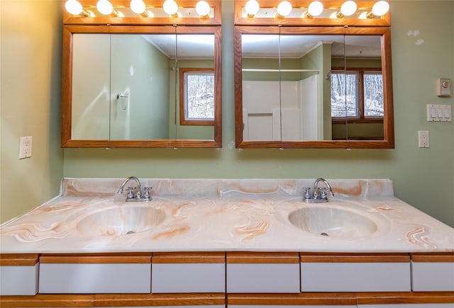 295 Overhill Rd, Stormville, NY 12582 - full bathroom featuring a sink, double vanity, and crown molding