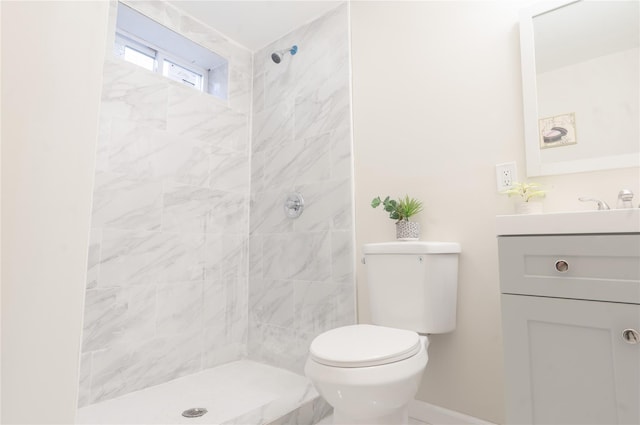 23 Cumberbach St, Wyandanch, NY 11798 - full bathroom with vanity, baseboards, toilet, and tiled shower