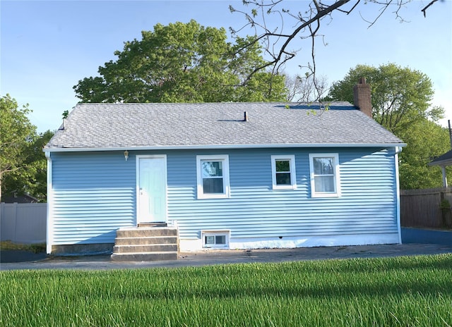 23 Cumberbach St, Wyandanch, NY 11798 - view of front of house featuring roof with shingles, fence, a chimney, and entry steps