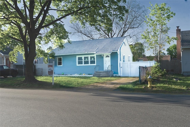 23 Cumberbach St, Wyandanch, NY 11798 - view of front of house featuring fence and roof with shingles