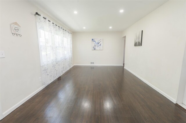 23 Cumberbach St, Wyandanch, NY 11798 - unfurnished room featuring recessed lighting, baseboards, and dark wood-style floors