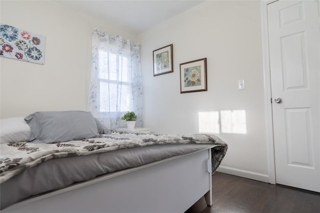 23 Cumberbach St, Wyandanch, NY 11798 - bedroom with dark wood-style flooring and baseboards