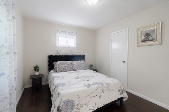 23 Cumberbach St, Wyandanch, NY 11798 - bedroom with baseboards and wood finished floors
