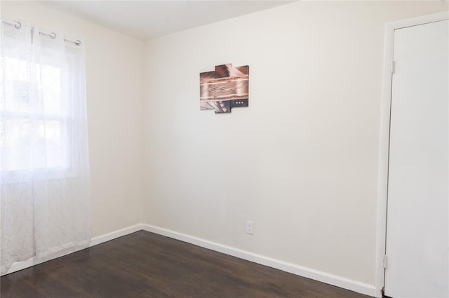 23 Cumberbach St, Wyandanch, NY 11798 - spare room with baseboards and dark wood-type flooring
