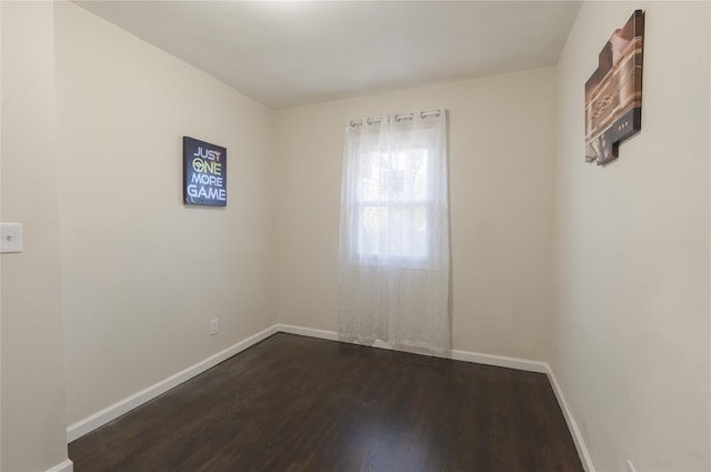 23 Cumberbach St, Wyandanch, NY 11798 - unfurnished room with baseboards and dark wood finished floors