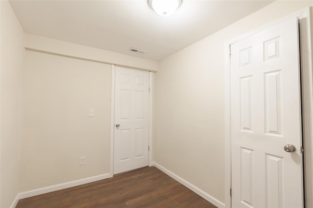 23 Cumberbach St, Wyandanch, NY 11798 - unfurnished room with baseboards, visible vents, and dark wood-style floors