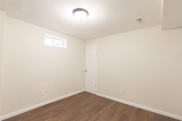 23 Cumberbach St, Wyandanch, NY 11798 - empty room with baseboards, dark wood finished floors, and visible vents