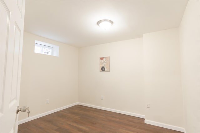 23 Cumberbach St, Wyandanch, NY 11798 - spare room featuring baseboards and dark wood-style floors