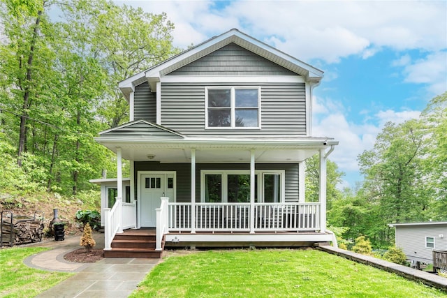 69 Taylor Rd, Patterson, NY 12563 - traditional style home featuring covered porch and a front lawn