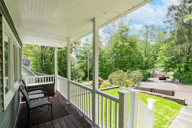 69 Taylor Rd, Patterson, NY 12563 - wooden porch with view of wooded area and a yard